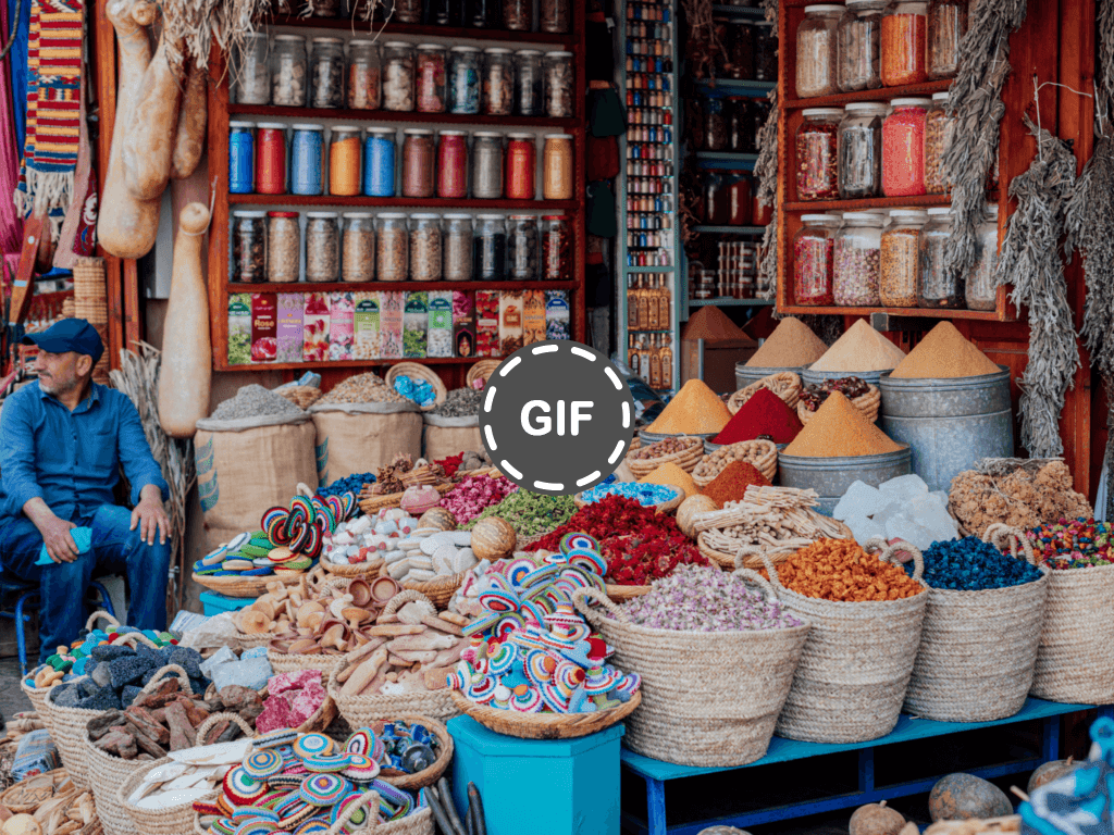 Vibrant streets of Fès, Morocco, showcasing traditional architecture and bustling markets filled with colorful textiles and pottery.